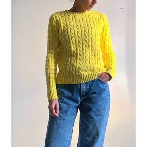 Yellow cable knit sweater.